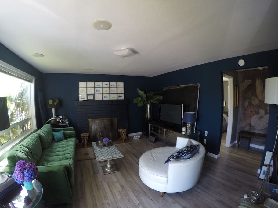 Chic and artful living room. Basic cable. Comfy couch.