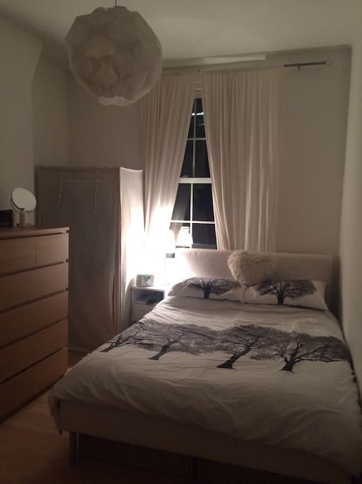 The Bedroom with storage and a large double Bed.