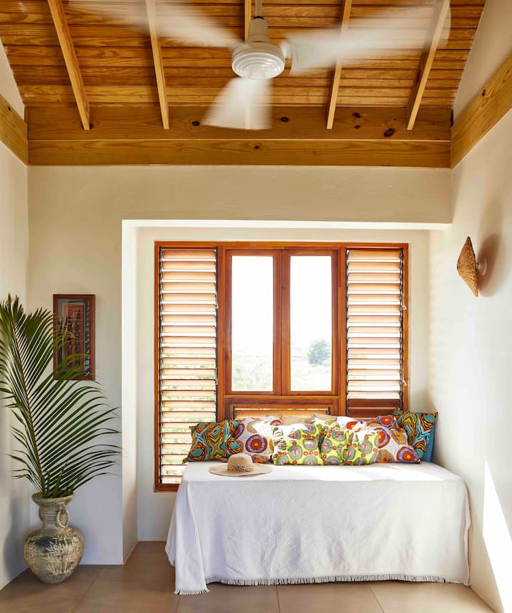 One of the two single beds in the upstairs lounge area. 