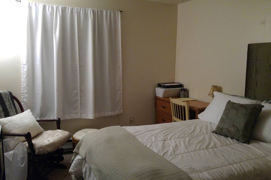 There is a desk and chair to use while staying.
