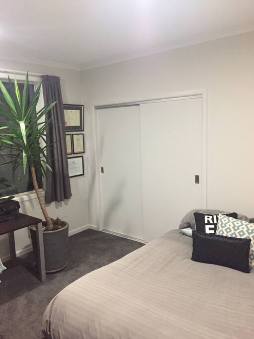 Bedroom 2 with queen bed, desk and chair