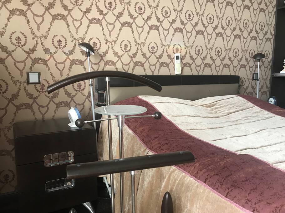 Clothes hanger by the bed
