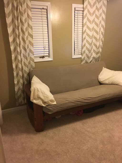Guest bedroom. Futon folds down to full size bed. Comfortable mattress.