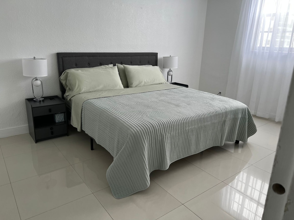 Indulge in our luxurious Master Bedroom with a king-size bed, offering a peaceful retreat for a restful night's sleep during your beachfront getaway.