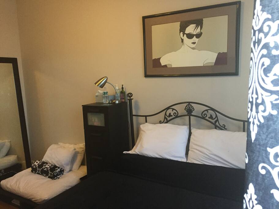 Extra large floor mirror situated next to a pallet couch that is used for lounging - No pets!