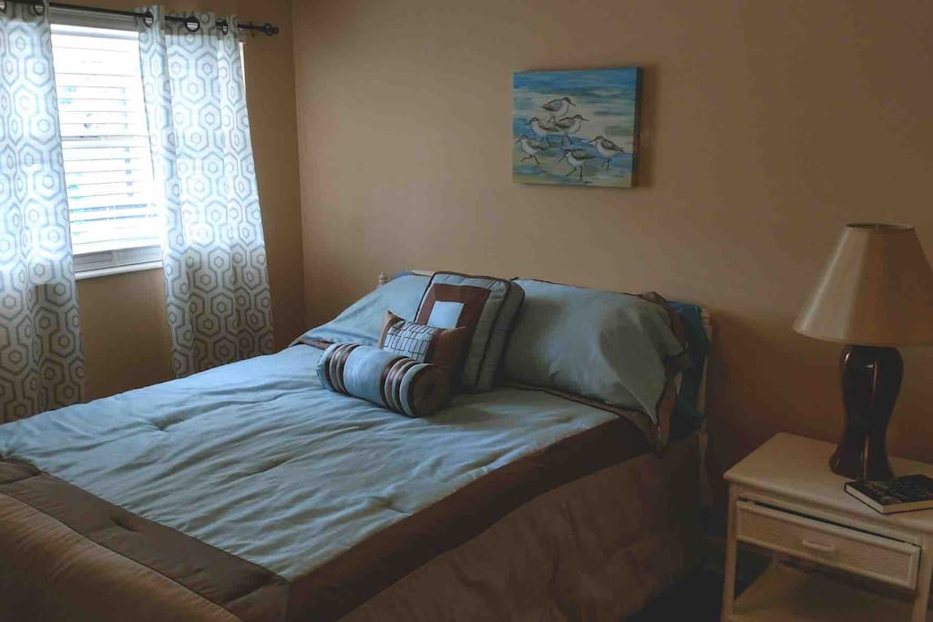 Queen bedroom looking out on oool