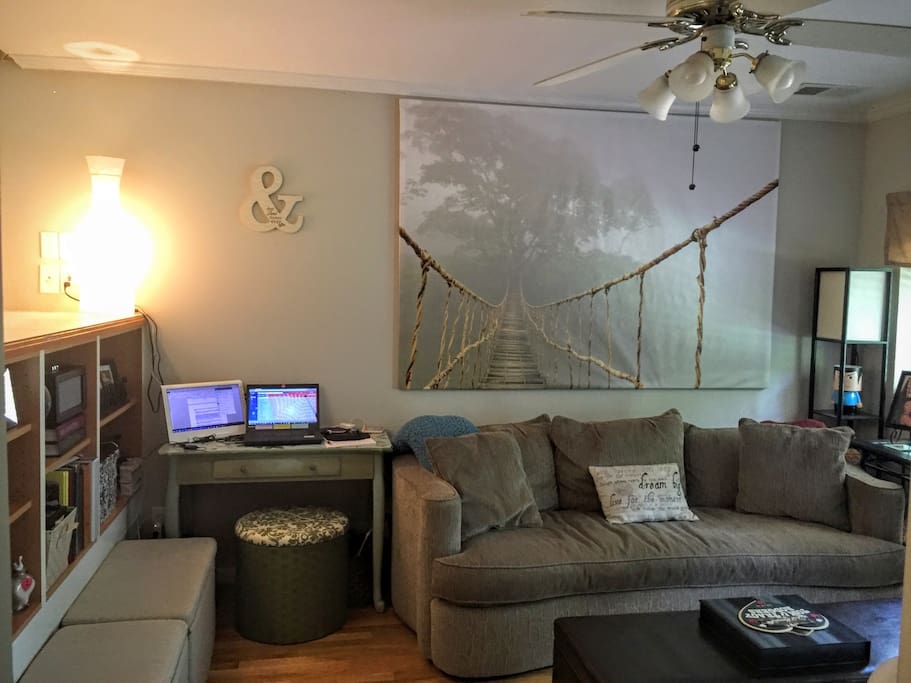 Living room with 55" curved high def TV & work area