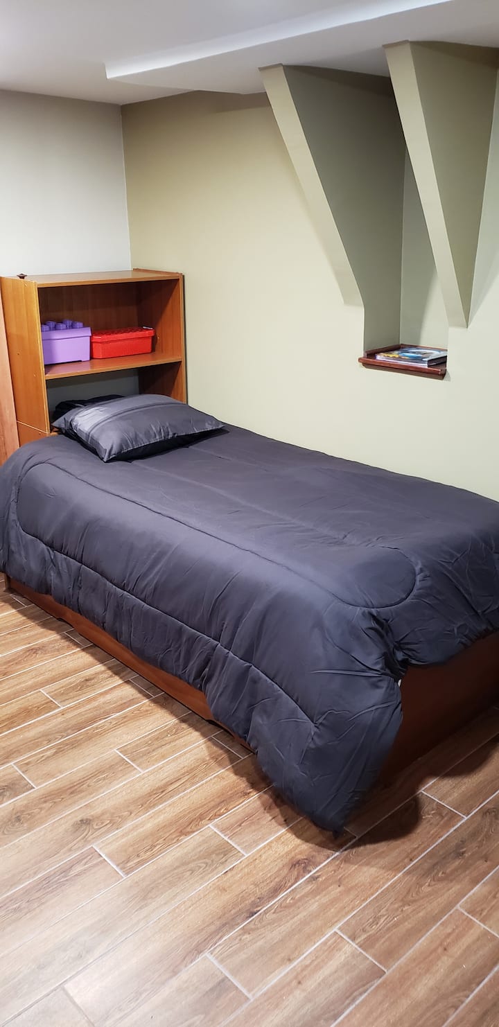 Single trundle bed with second bed in a drawer beneath the top bed