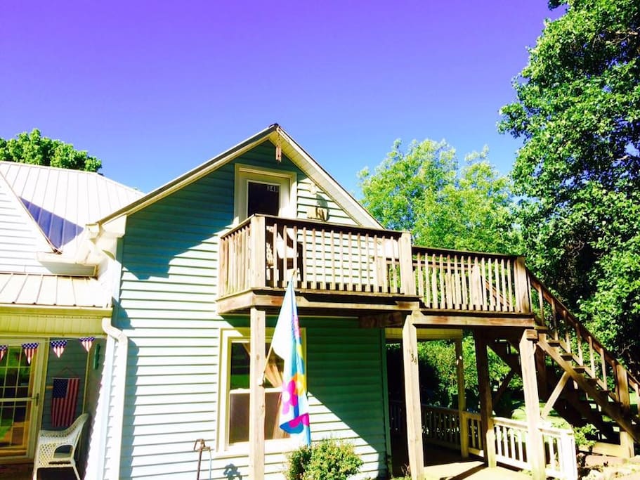Apartment entrance from outside stairs which leads to a lovely view above on deck.