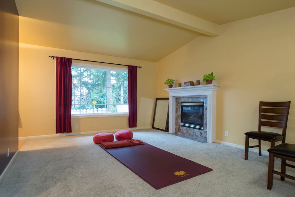 Relaxation room with with yoga-meditation mat, big window, open view onto front yard (added large 3 seater reclining white leather couch to room)