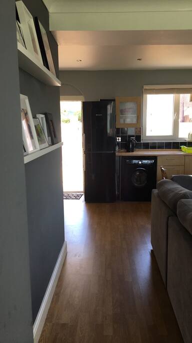 Washing machine and fridge freezer and easy access when entering making it easy for suitcases to be taken in and out.