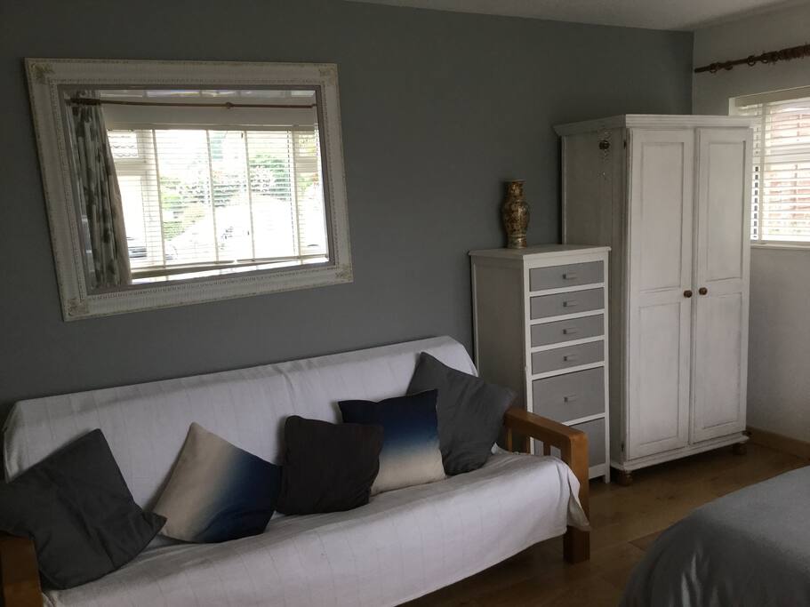 Double futon in double bedroom for either sitting and reading or pulled out for sleeping