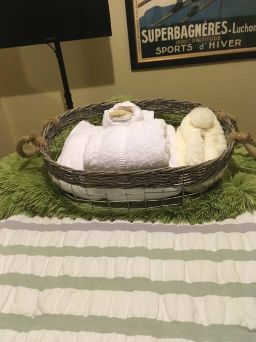 White cotton terry towels, hand towel, wash clothes, soap and shower cap. Closet in bathroom with hairdryer,extra towels, full length mirror, soap, cream. Room for extras.