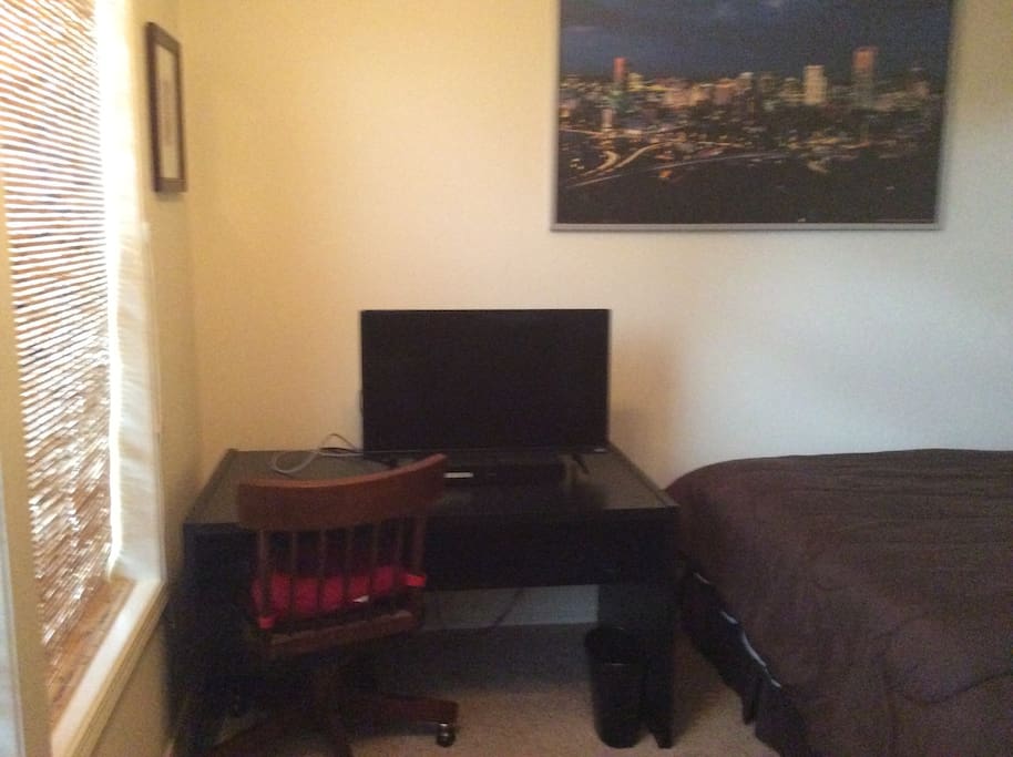 Desk with TV and DVD player.