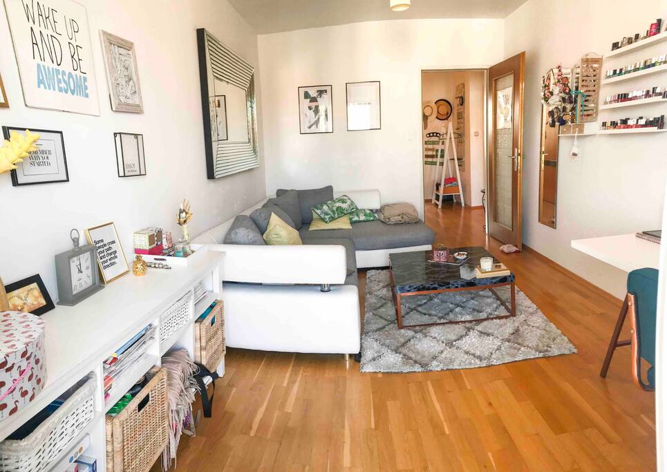 Living room with couch and working desk.
