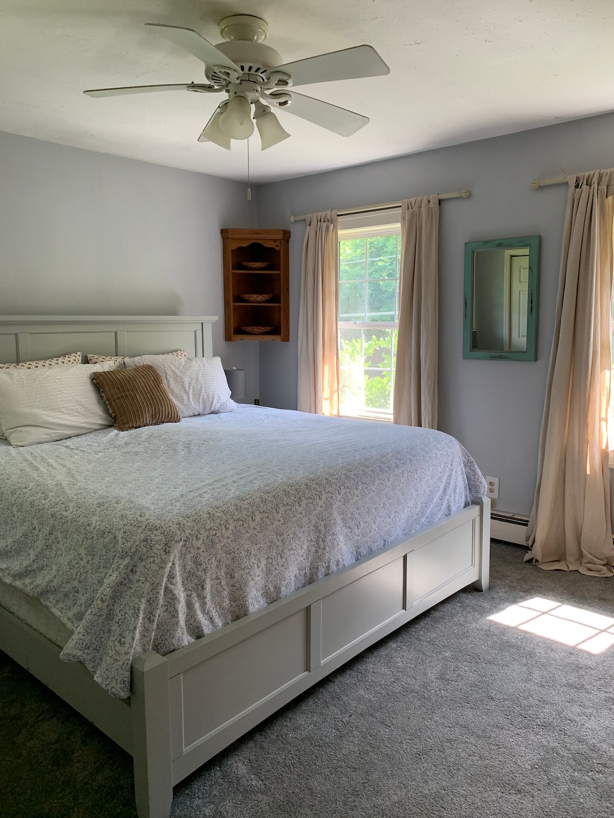 Master bedroom with private bathroom. King bed, dresser, & two closets. 