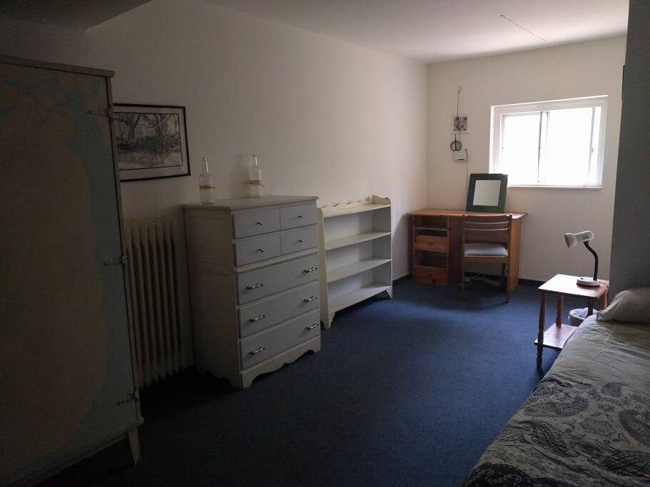 Desk, closet, wardrobe and shelves.