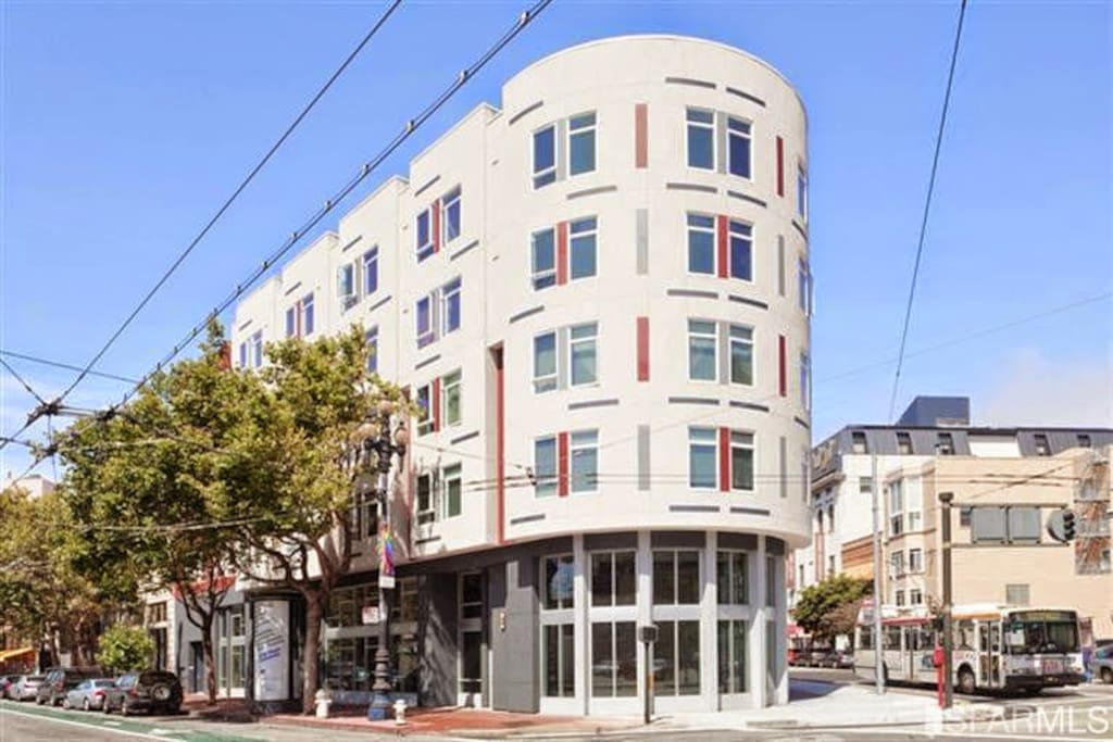 Building exterior, my unit is on the top floor (circular). I have strong wifi which works from the street. You can use it to contact me if you need internet access