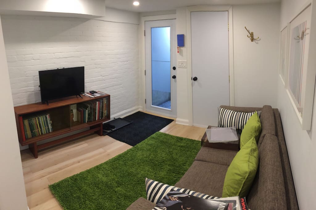 living room with modern decor, comfy but stylish couch and android box on the flat screen