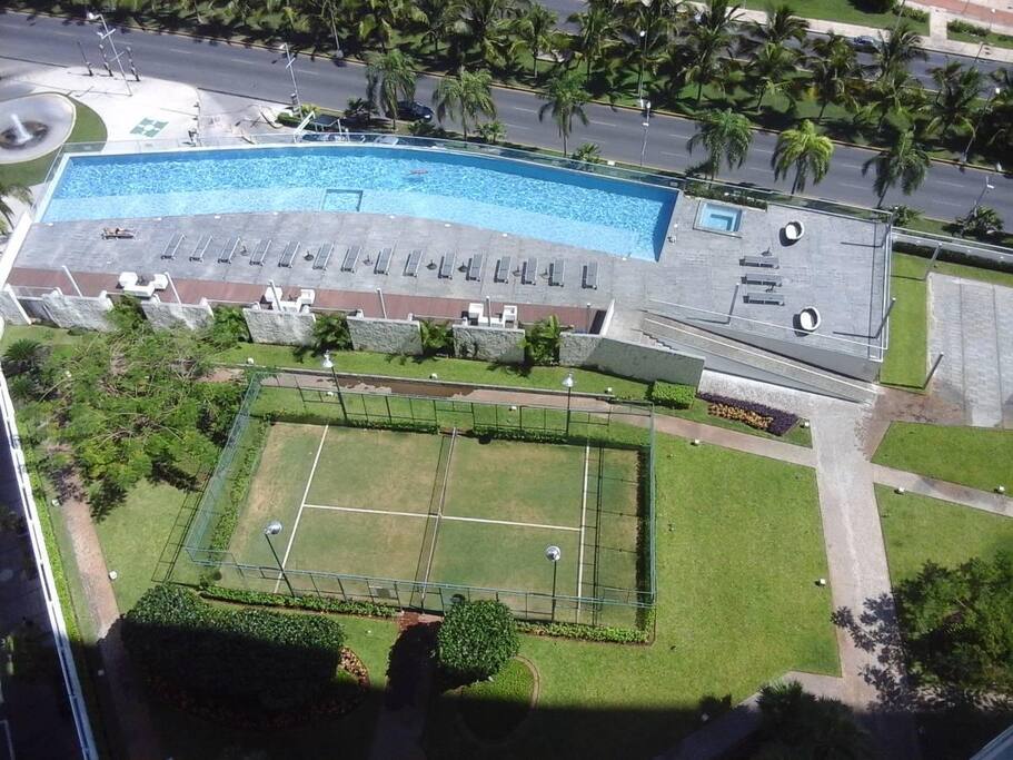 outdoor areas with paddle court and bbq areas.