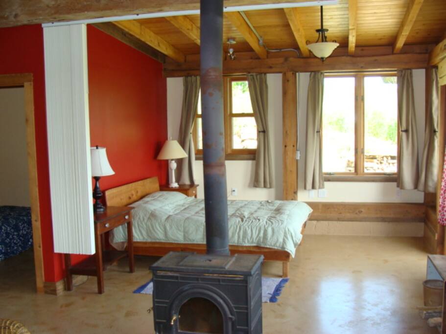 Sunny bedroom area with privacy screen in your suite