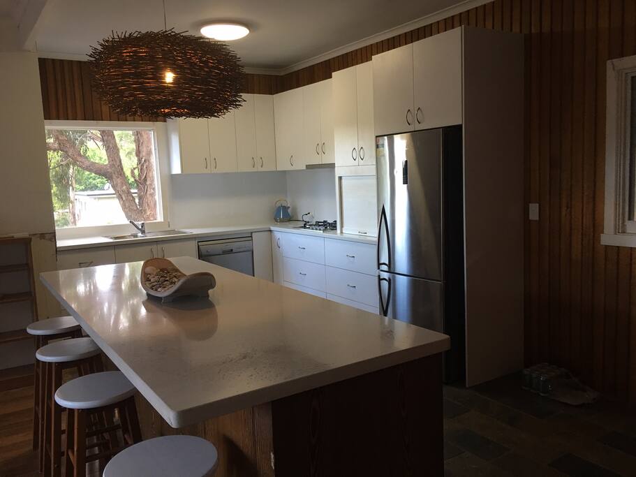 Beautiful open plan kitchen to gather around for a drink