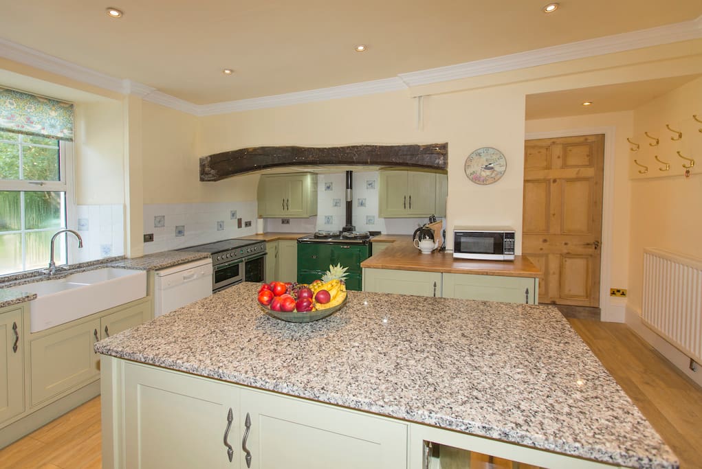 The kitchen area includes an American fridge/freezer, electric double cooker, an aga for winter.