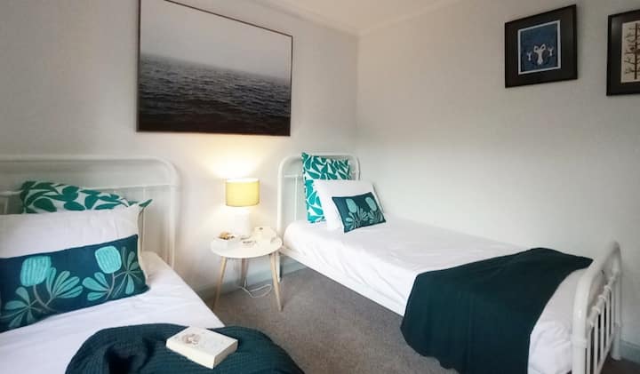 "Cosy Corner Room" is an afternoon sunshine filled room. Upstairs looking out to the west, this room is bright and airy with two single beds and large robe.