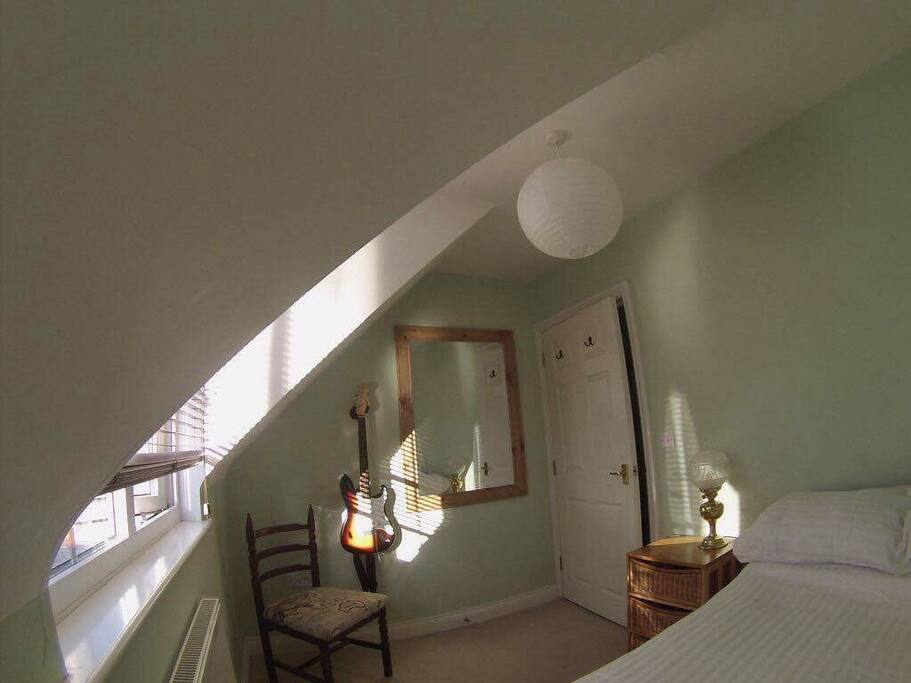 Room two!! A queen bed. Light and bright!!