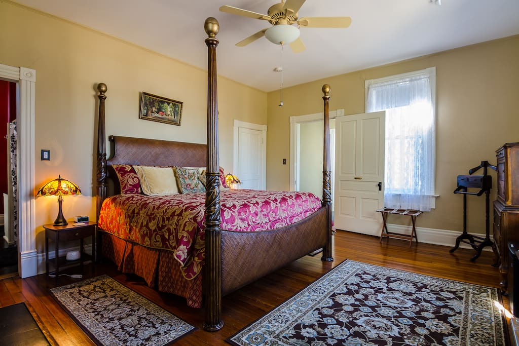 The Magnolia Suite features antique furnishings and four-poster bed