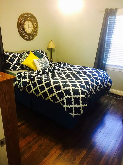 Blue Room. Queen bed with vanity, closet with hangers & chest of drawers.