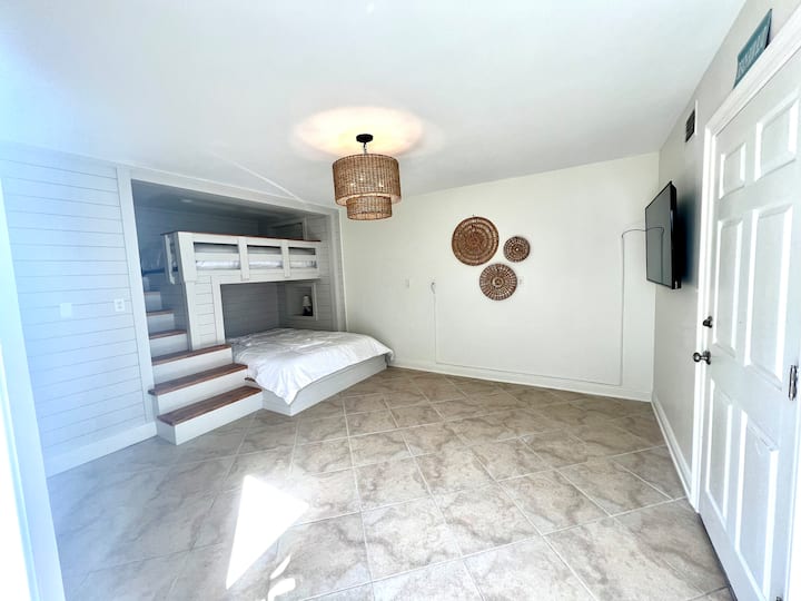 Downstairs bonus room sleeps five with full bath, perfect for mother in laws or teens. Smart TV included. 