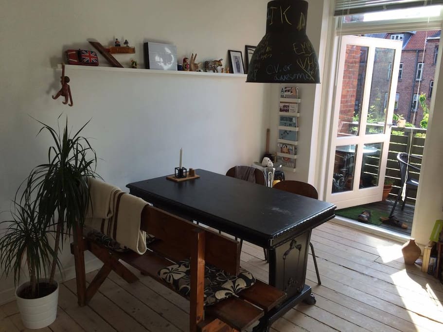 The kitchen-dining area with the balcony at the end.