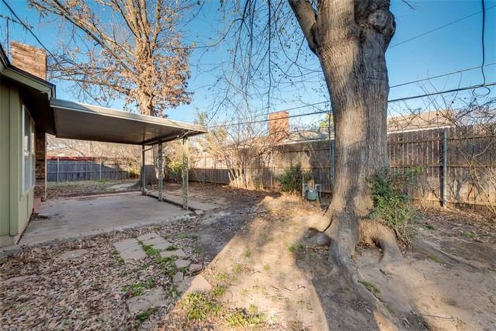 Spacious backyard with covered patio for entertaining. We have table and 2 folding chairs.