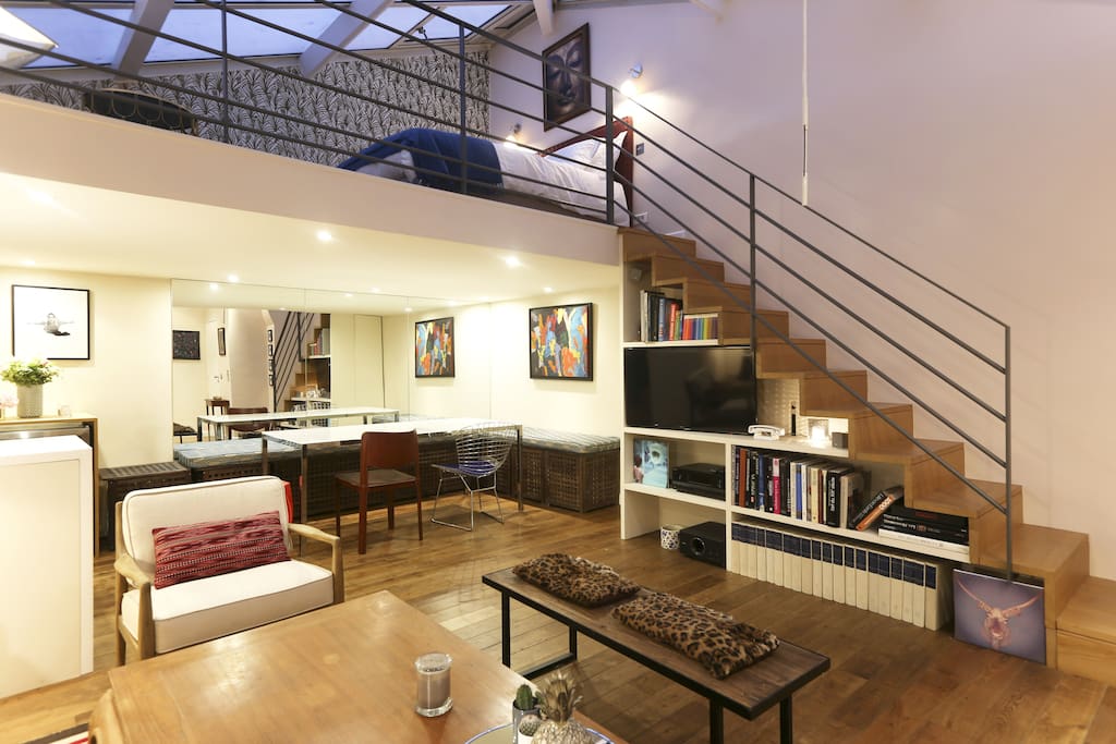 The living with the "library stairs" to go to the bedroom