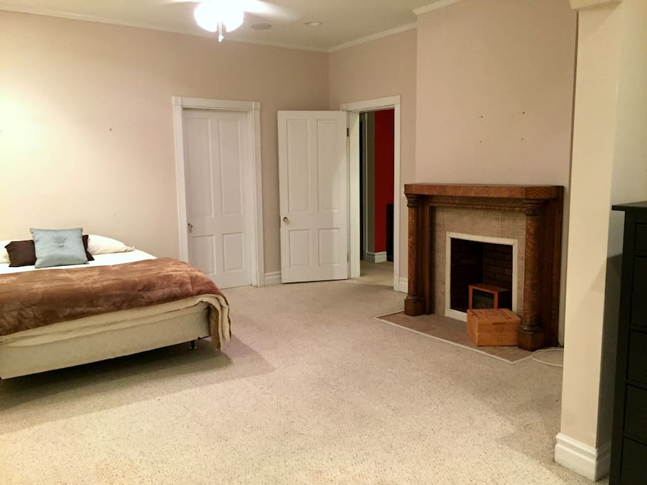 Spacious master bedroom with queen bed