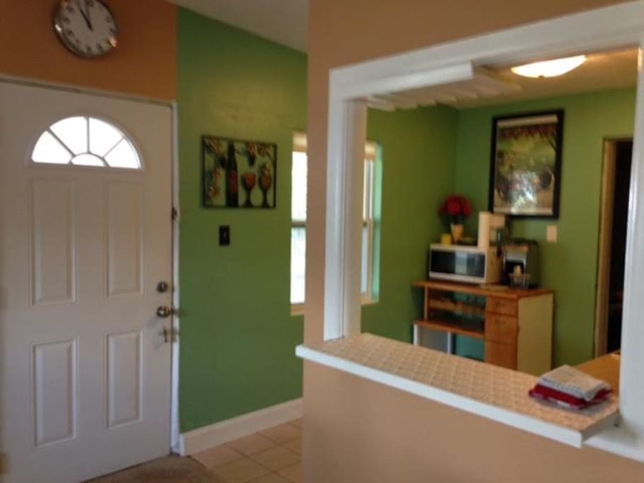 Front door and kitchen area