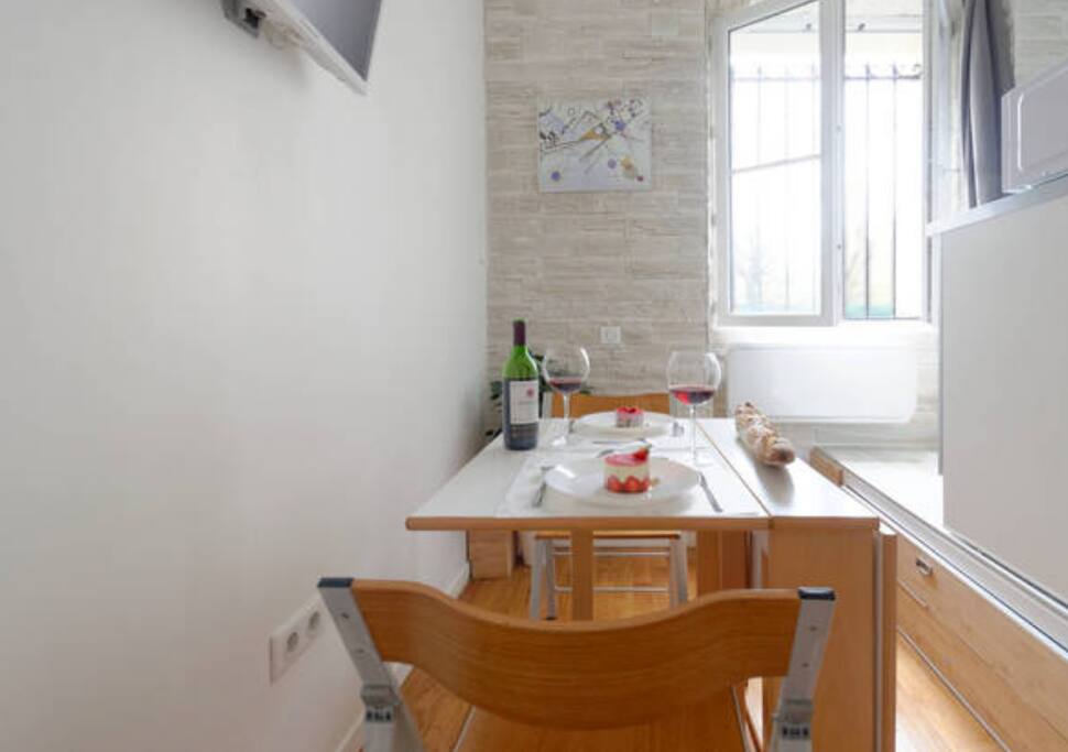 Romantic dinner for two persons once you slide the bed under the kitchen and unfold the table.