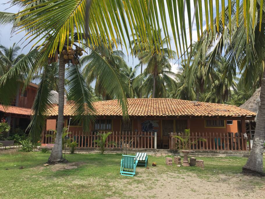 House in front of the waves