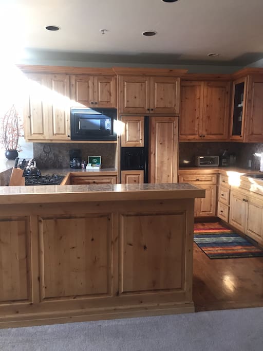 Large kitchen, lots of counter space. Eat in bar overlooks the livingroom