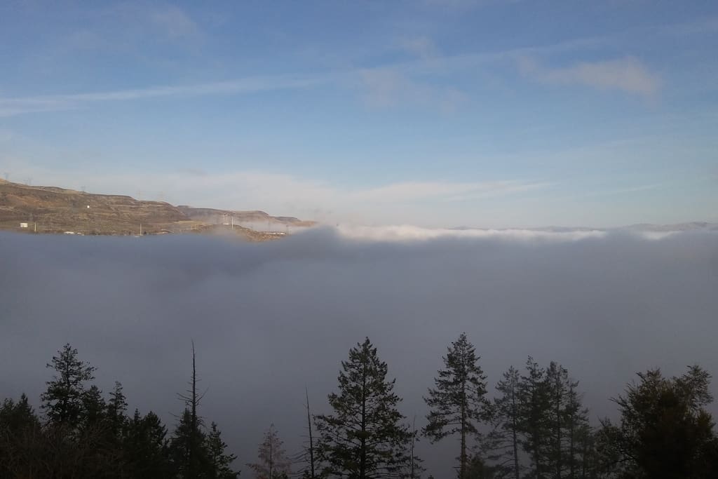 view of dam, spring morning, fog covering water.
