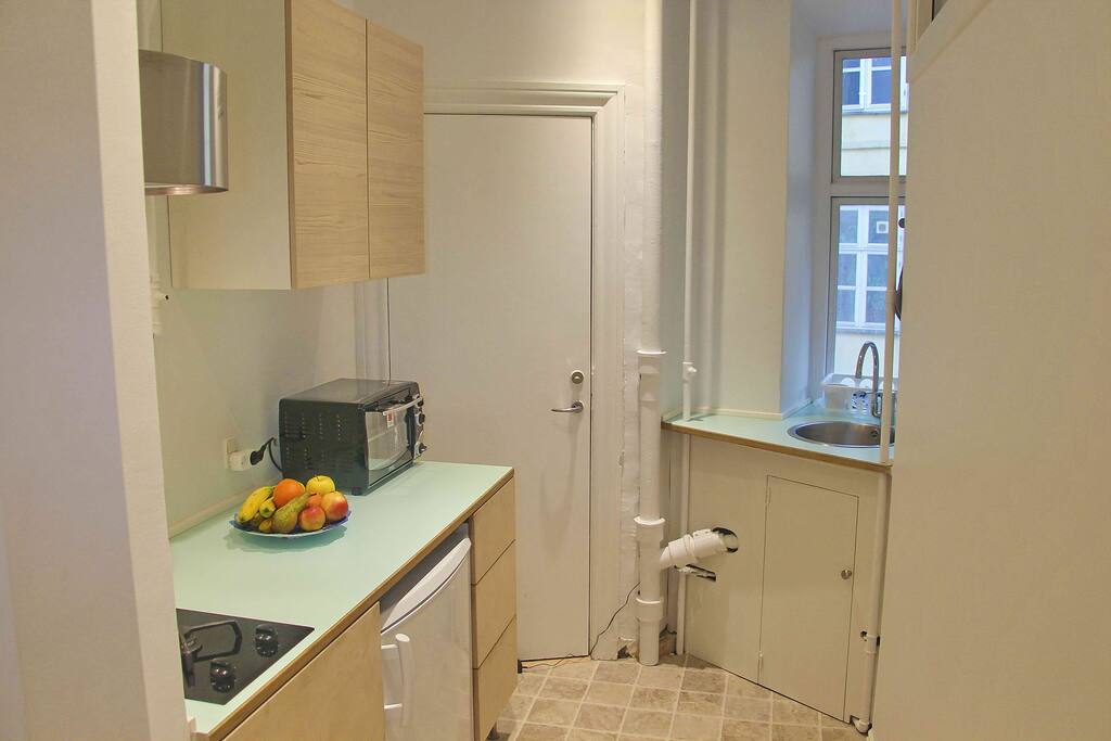Kitchen with gas stove, micro oven, bluetooth/FM radio.