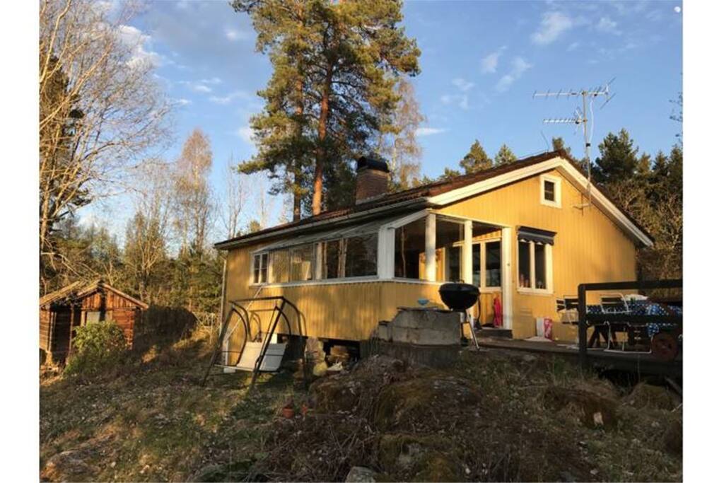 Terrace to the right and an extra room to the left with glass windows.