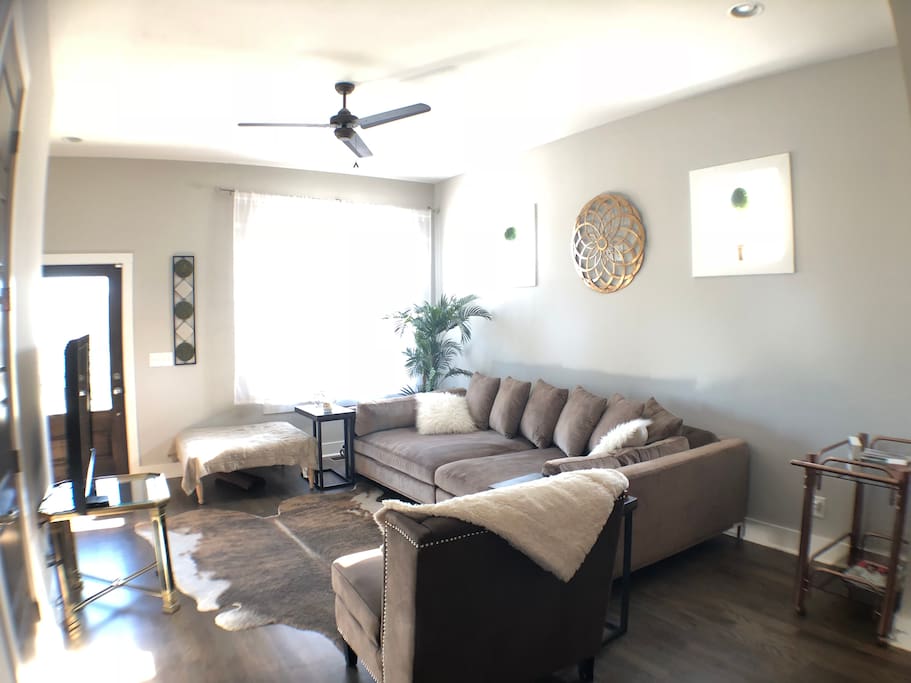 Living room and kitchen have an open layout and perfect for groups! This couch is like a full bed at 120" long and 60" deep - guests give it 5 stars for sleeping!