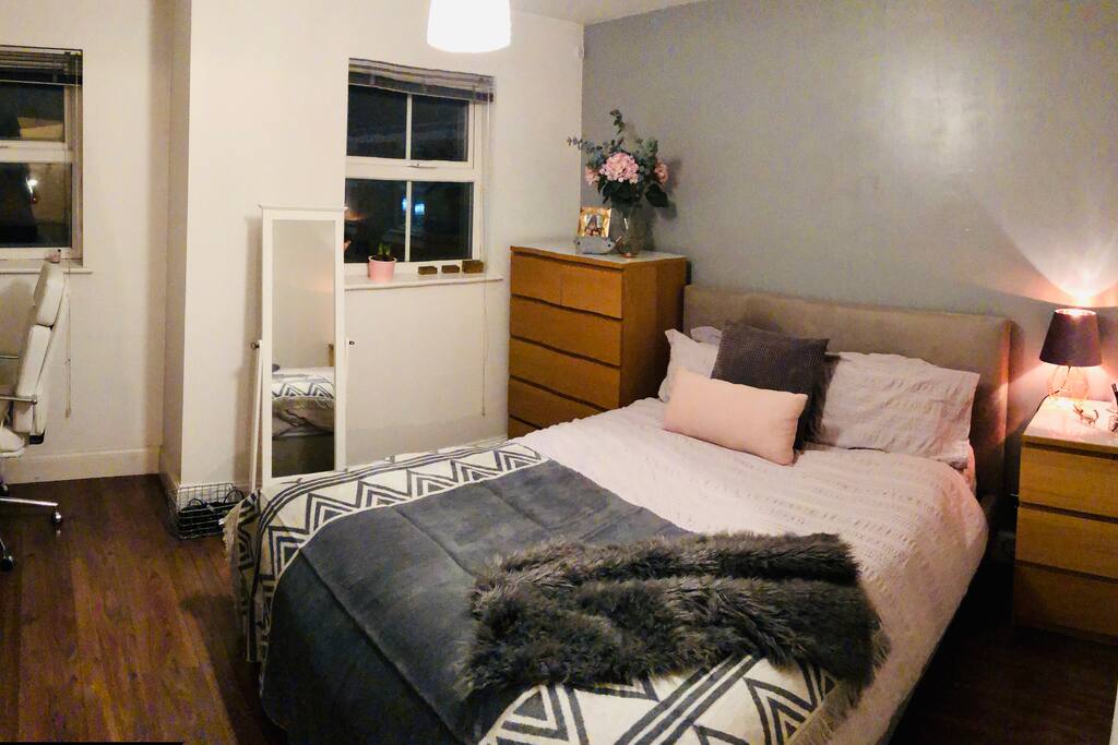 Master bedroom with king size bed and relaxing colour scheme