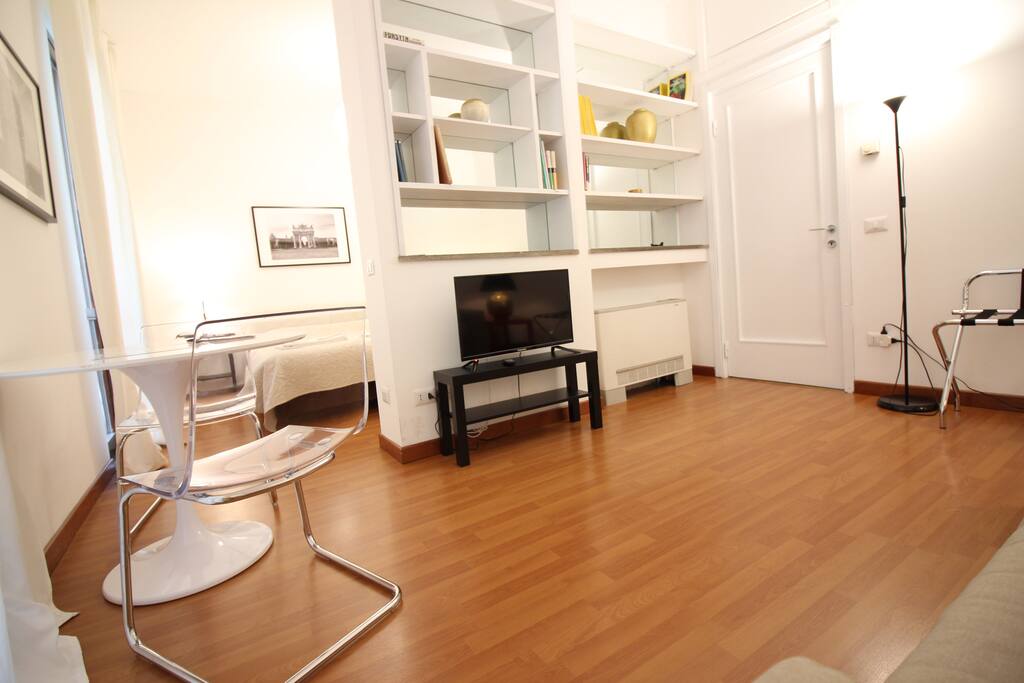 living room with 32' tv and a table