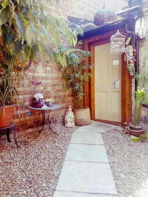 The private courtyard with private entrance leading into the cottage