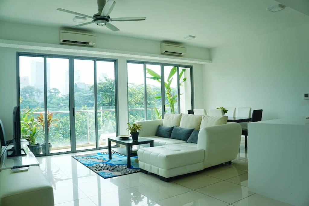 1755 sq ft. Cosy living room looking out to the lush tropical green.