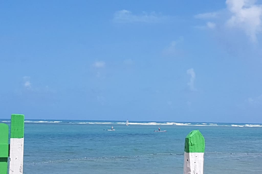 Praia em frente a casa