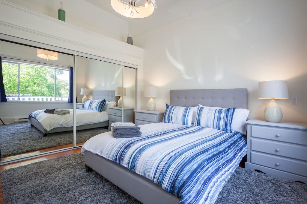 Bright and spacious bedroom 1 with lots of room for your bags and a wall length closet.